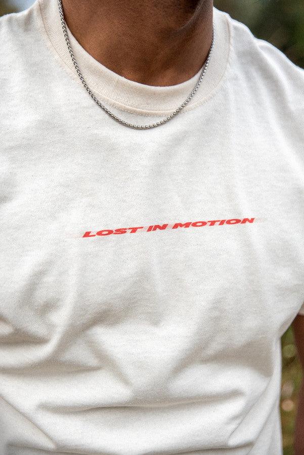 Otusi T-Shirt in Neutral With Lost In Motion Logo Print